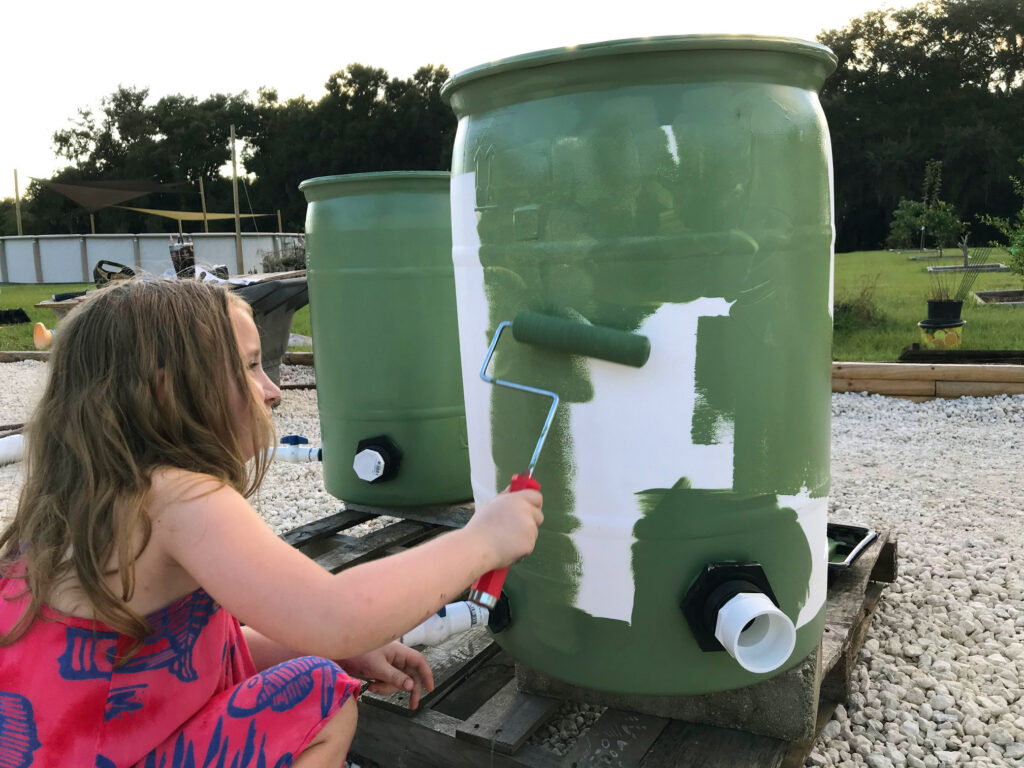 Kaylee painting a barrel